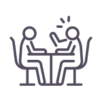 Line icon of two people seated at a table. One is talking and the other is listening.